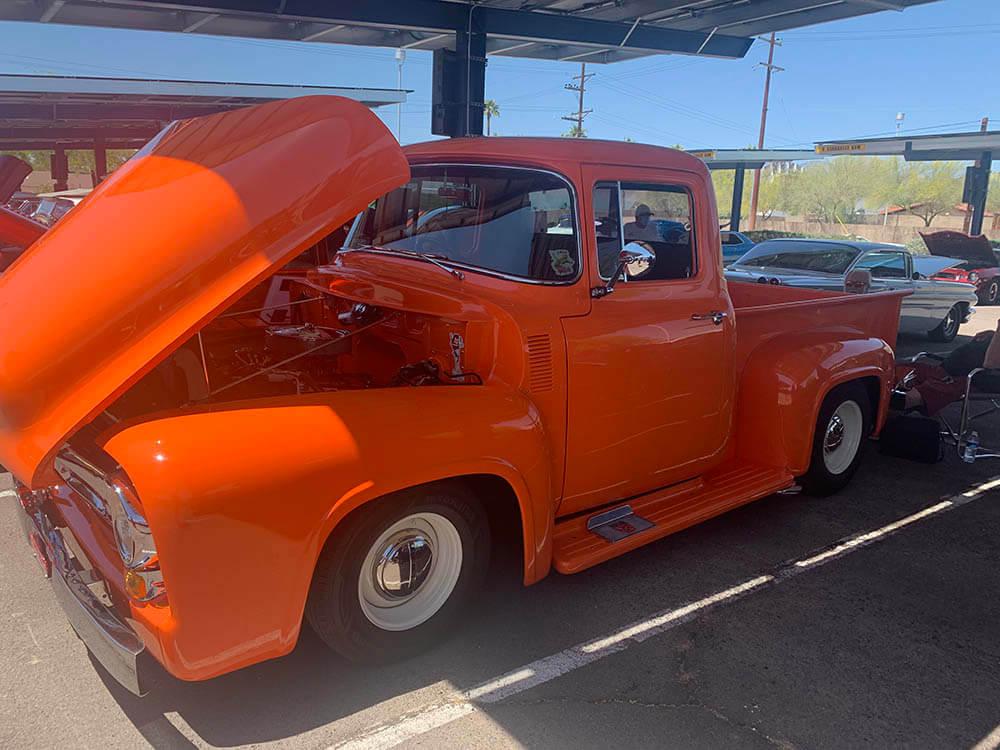 An orange truck at a Car Show at Downtown Campus